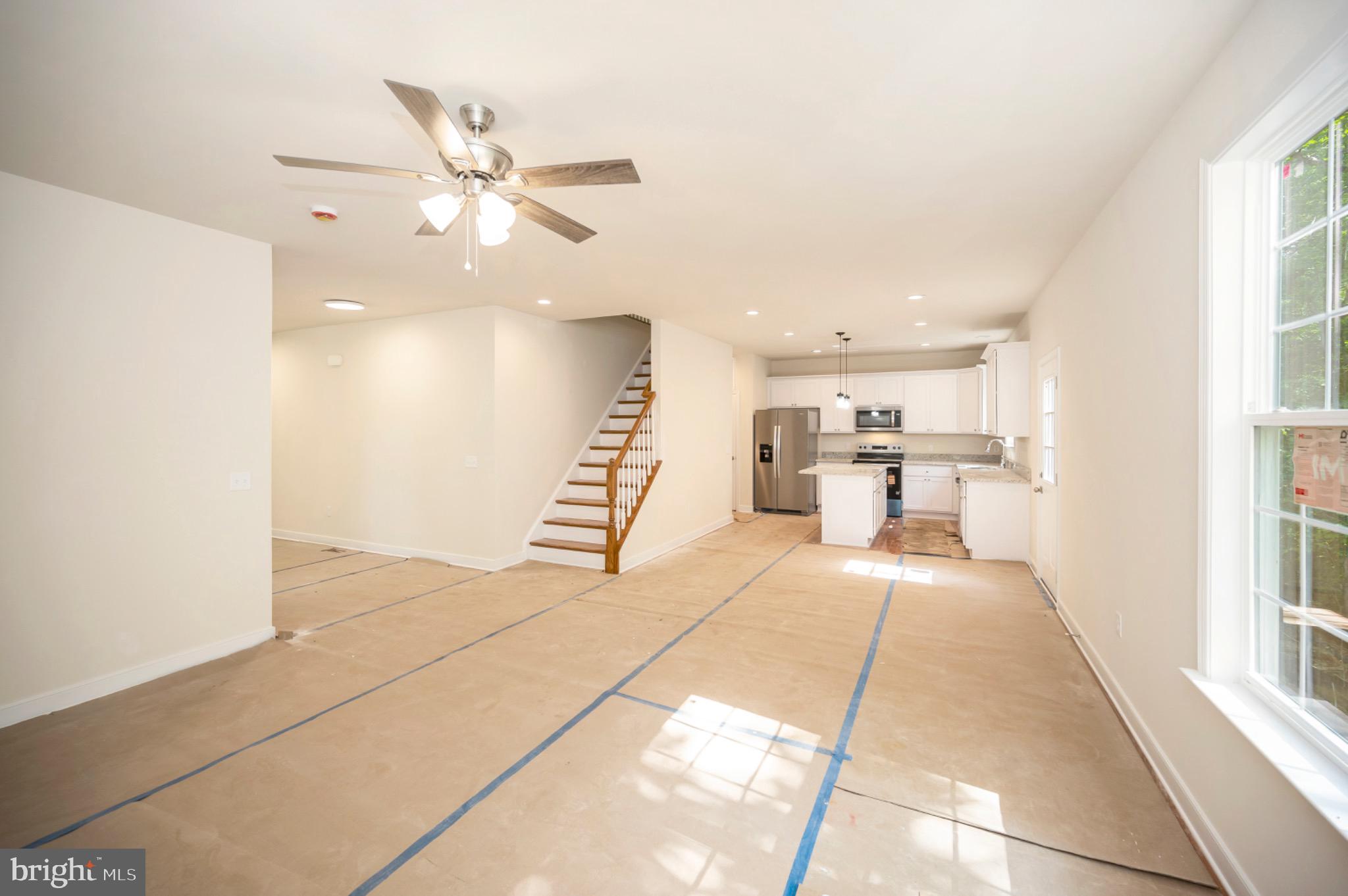 6077 Hamlin Circle King George, VA 22485 - Photo 21 of 50 a view of a livingroom with a ceiling fan and window