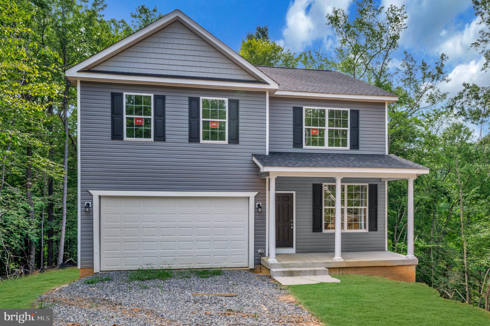 6077 Hamlin Circle King George, VA 22485 - Photo 3 of 50 front view of a house with a yard