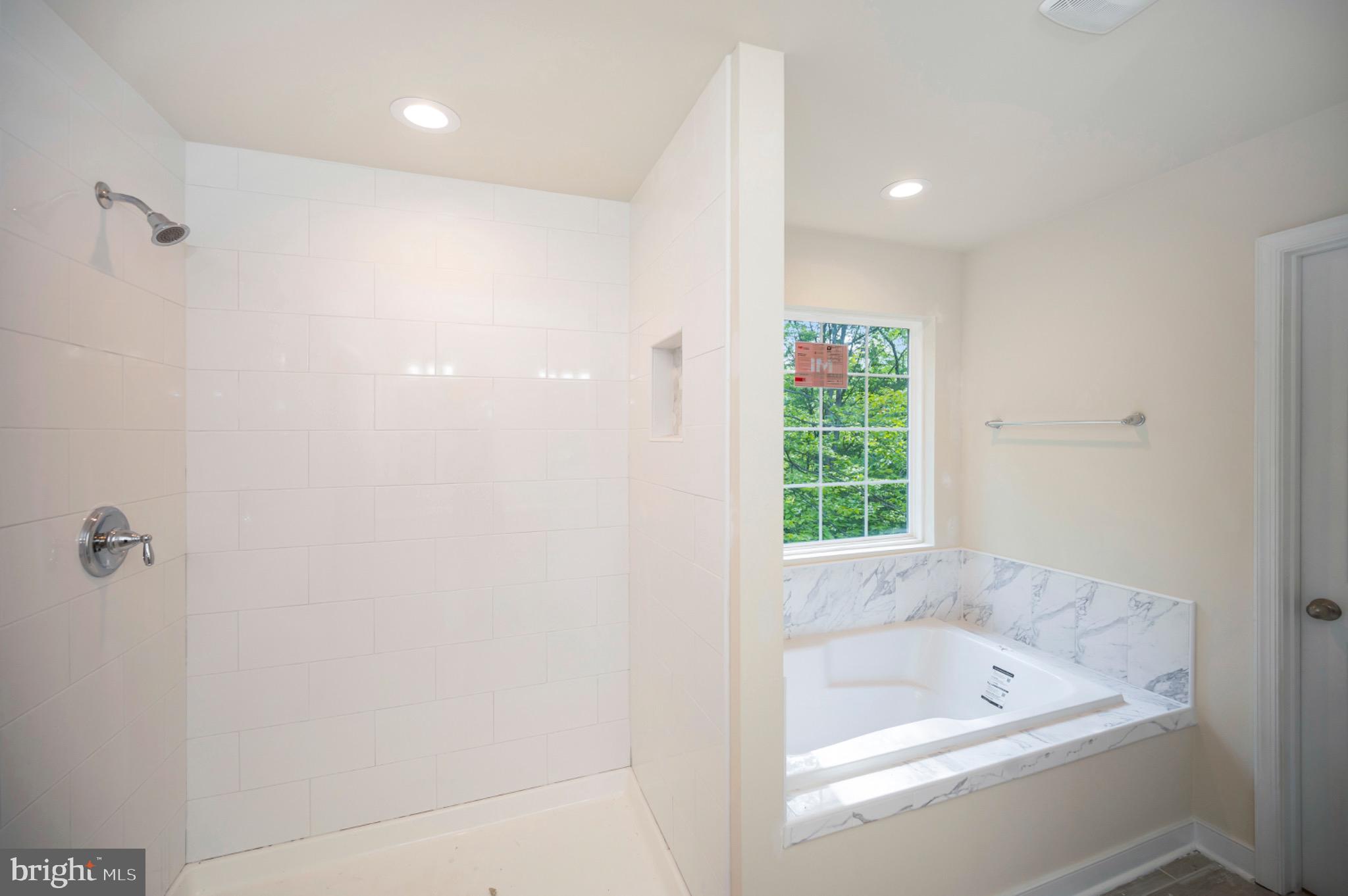 6077 Hamlin Circle King George, VA 22485 - Photo 34 of 50 a bathroom with a bathtub and shower