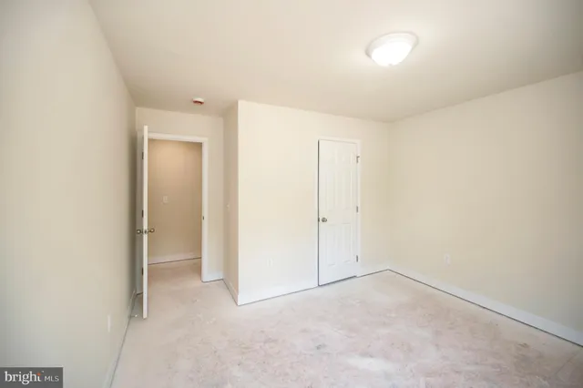 a bathroom with a toilet a sink and a window