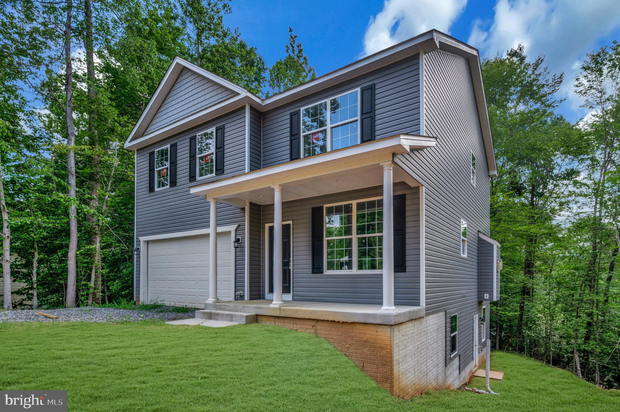 6077 Hamlin Circle King George, VA 22485 - Photo 5 of 50 front view of a house with a yard