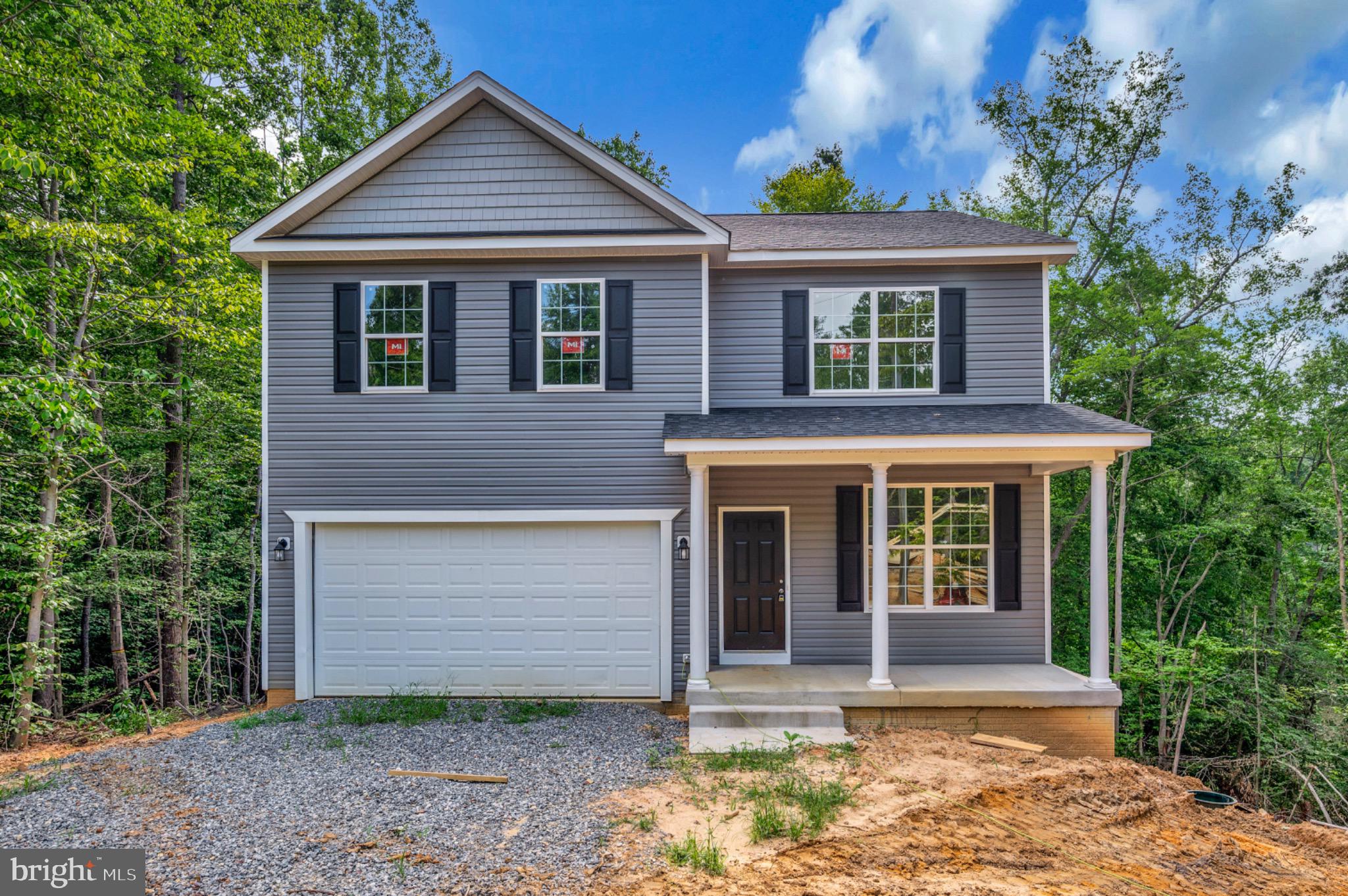 6077 Hamlin Circle King George, VA 22485 - Photo 9 of 50 a front view of a house with garden