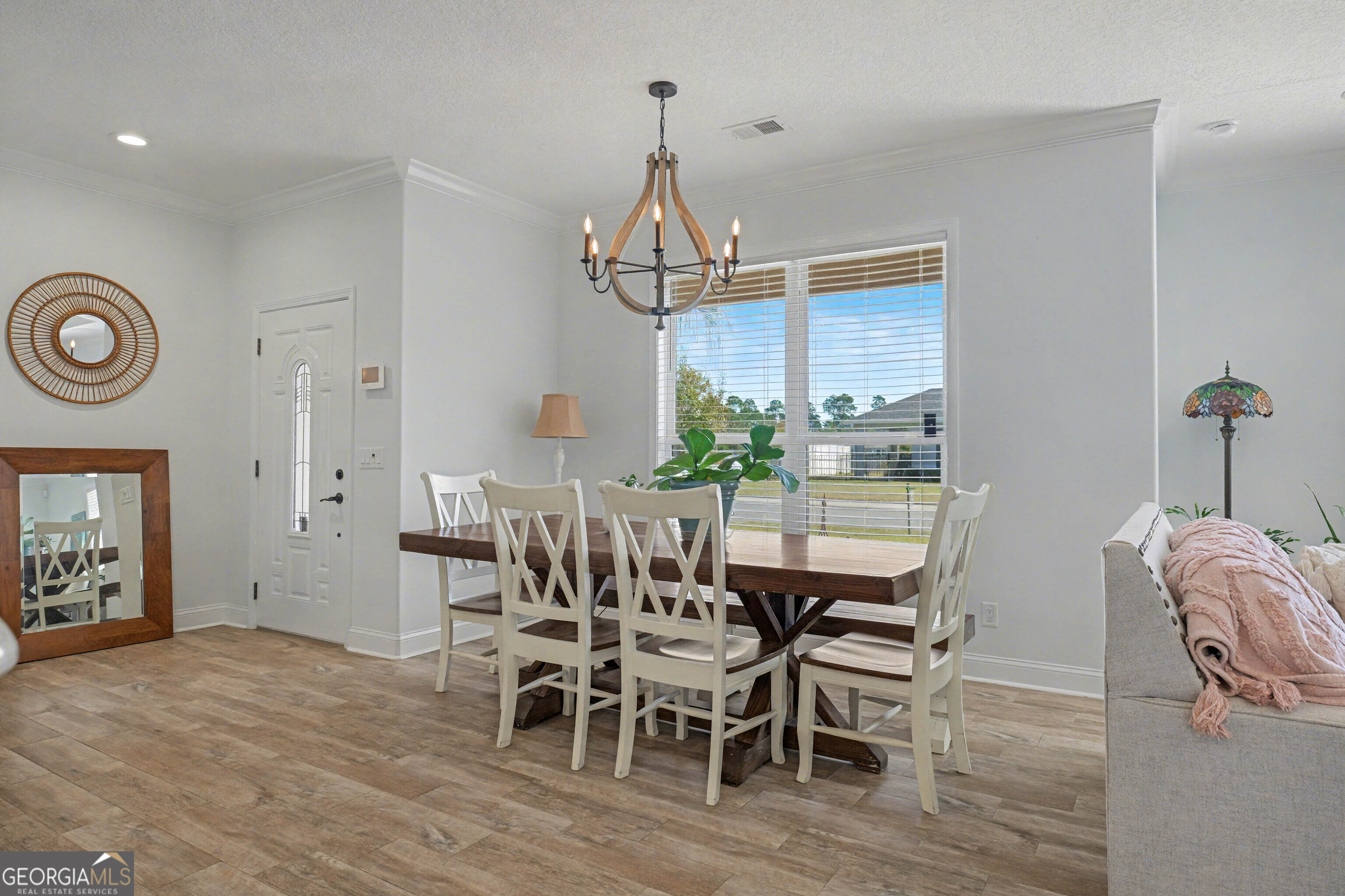 102 Thomas Court Kingsland, GA 31548 - Photo 11 of 59 a view of a dining room with furniture window and wooden floor