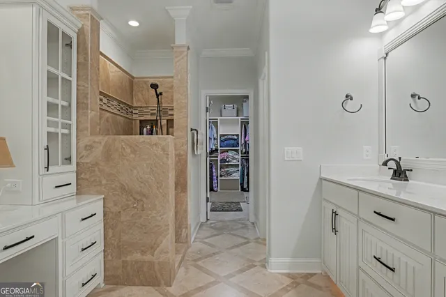 a bathroom with a shower sink and mirror