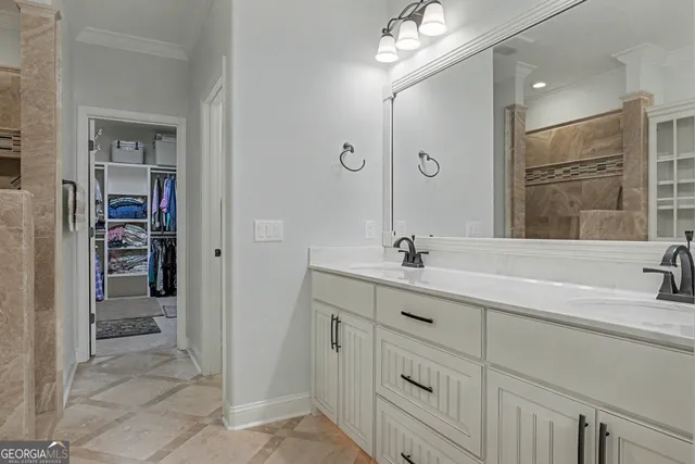 a bathroom with double vanity sink and a mirror