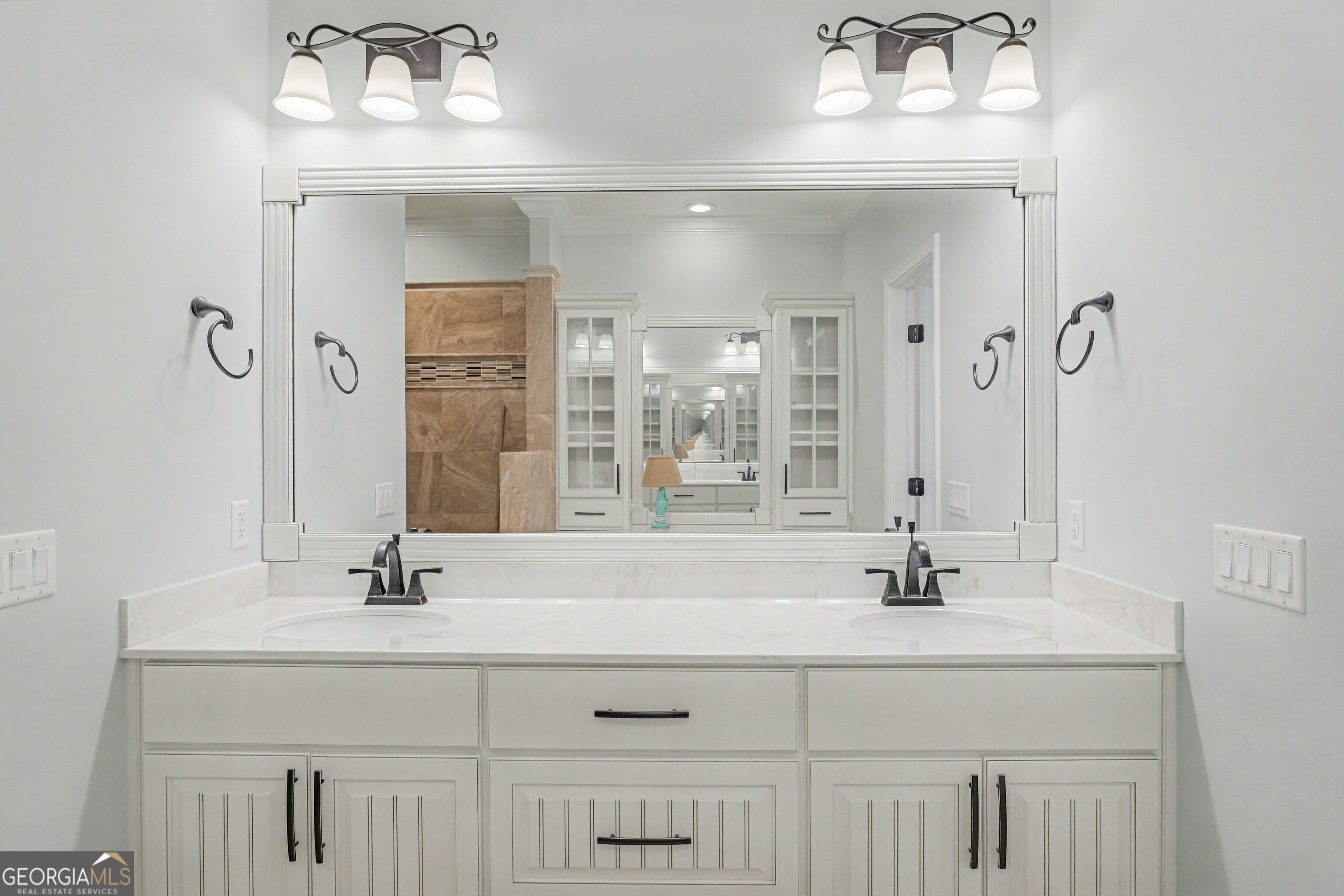 102 Thomas Court Kingsland, GA 31548 - Photo 24 of 59 a bathroom with double vanity sink and a mirror