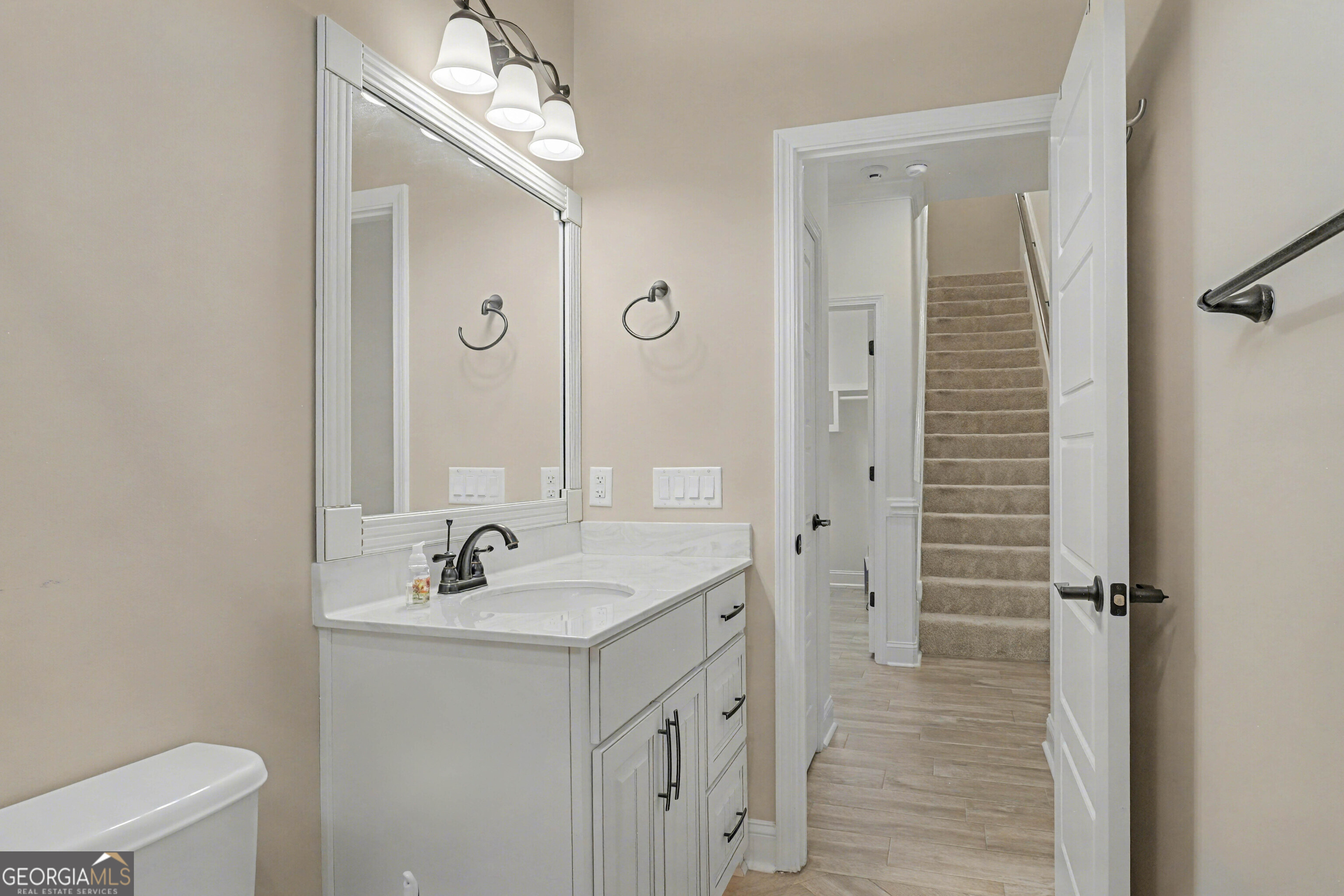 102 Thomas Court Kingsland, GA 31548 - Photo 33 of 59 a bathroom with a double vanity sink mirror and shower