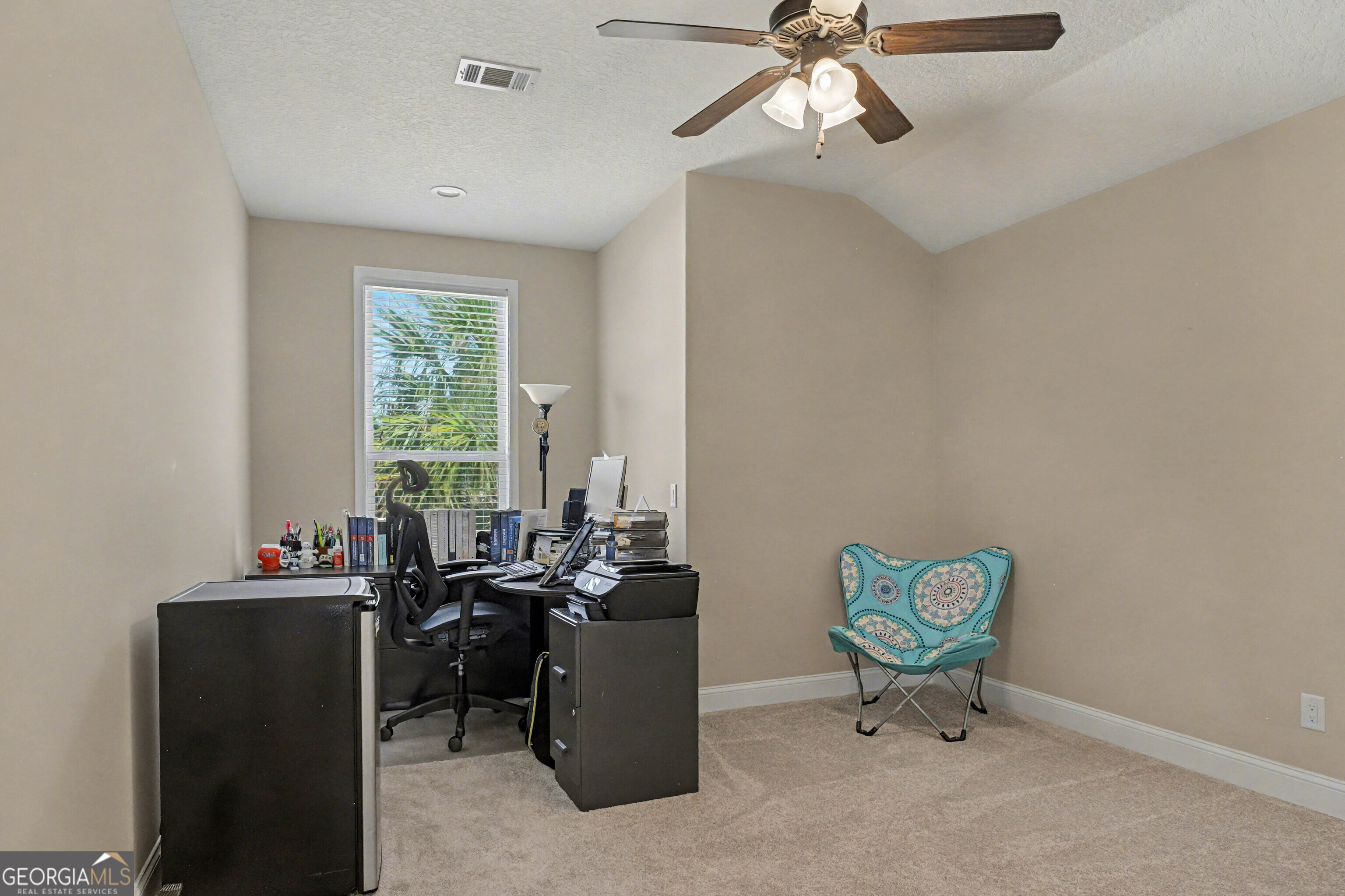 102 Thomas Court Kingsland, GA 31548 - Photo 35 of 59 a view of a workspace with furniture and a window