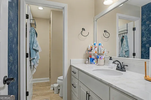 a room with gym equipment and a flat screen tv