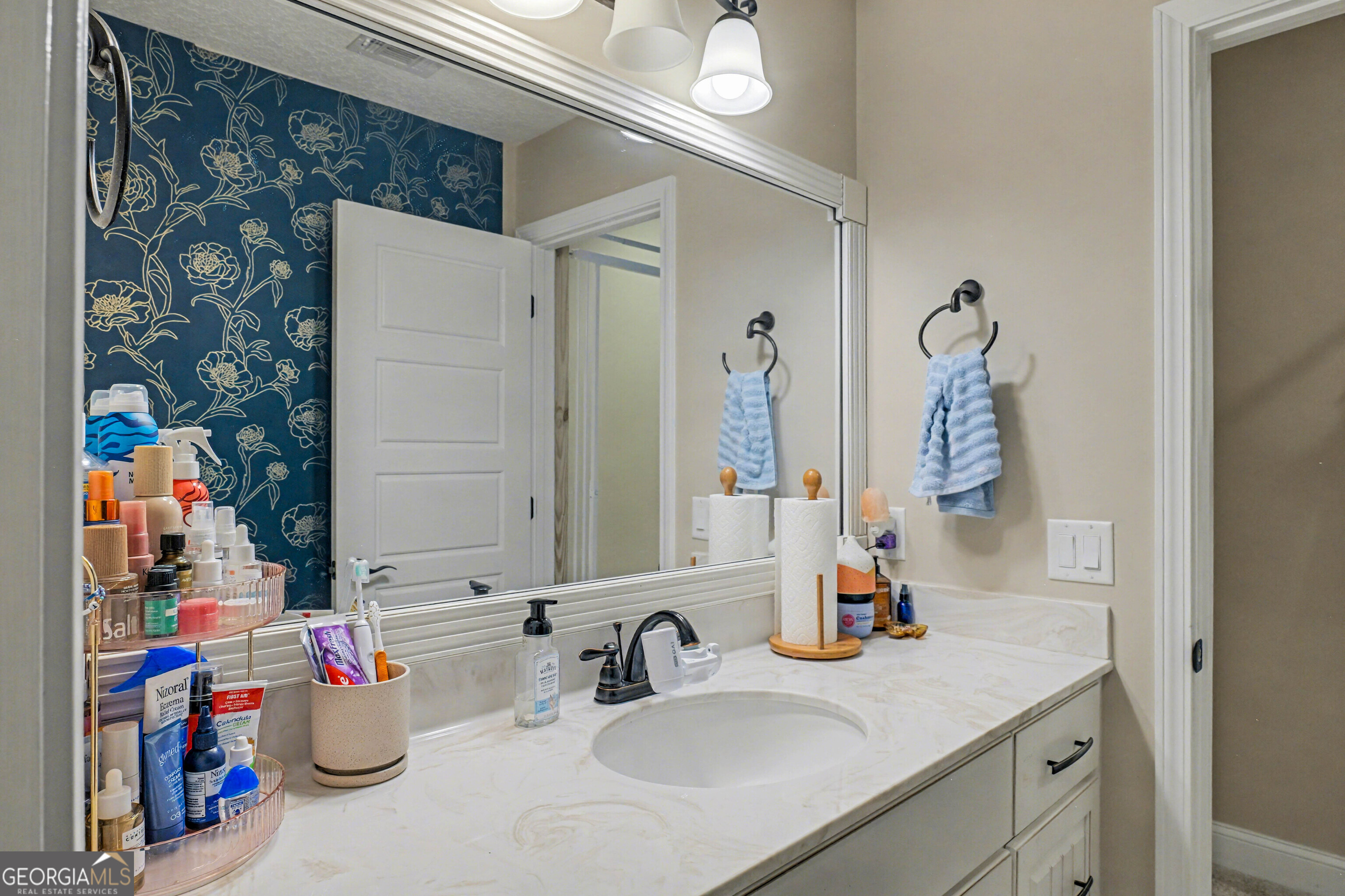 102 Thomas Court Kingsland, GA 31548 - Photo 38 of 59 a bathroom with a sink and a mirror