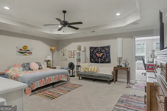 a view of a porch with furniture and a yard