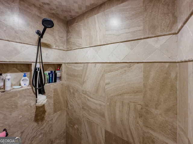 an aerial view of a house with a yard and a fountain