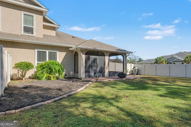 a view of a table and chairs under an umbrella