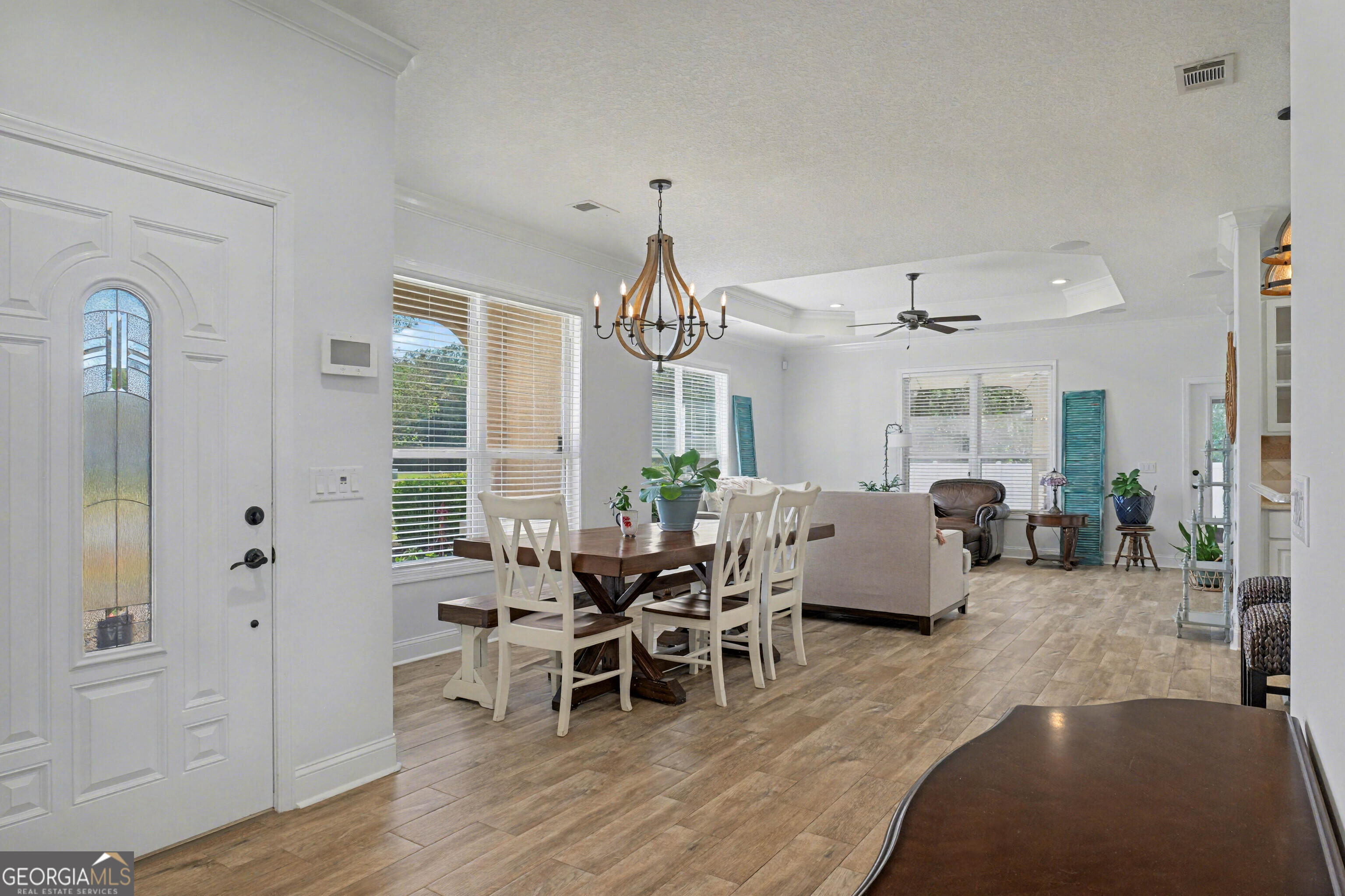 102 Thomas Court Kingsland, GA 31548 - Photo 5 of 59 a living room with furniture wooden floor and a chandelier