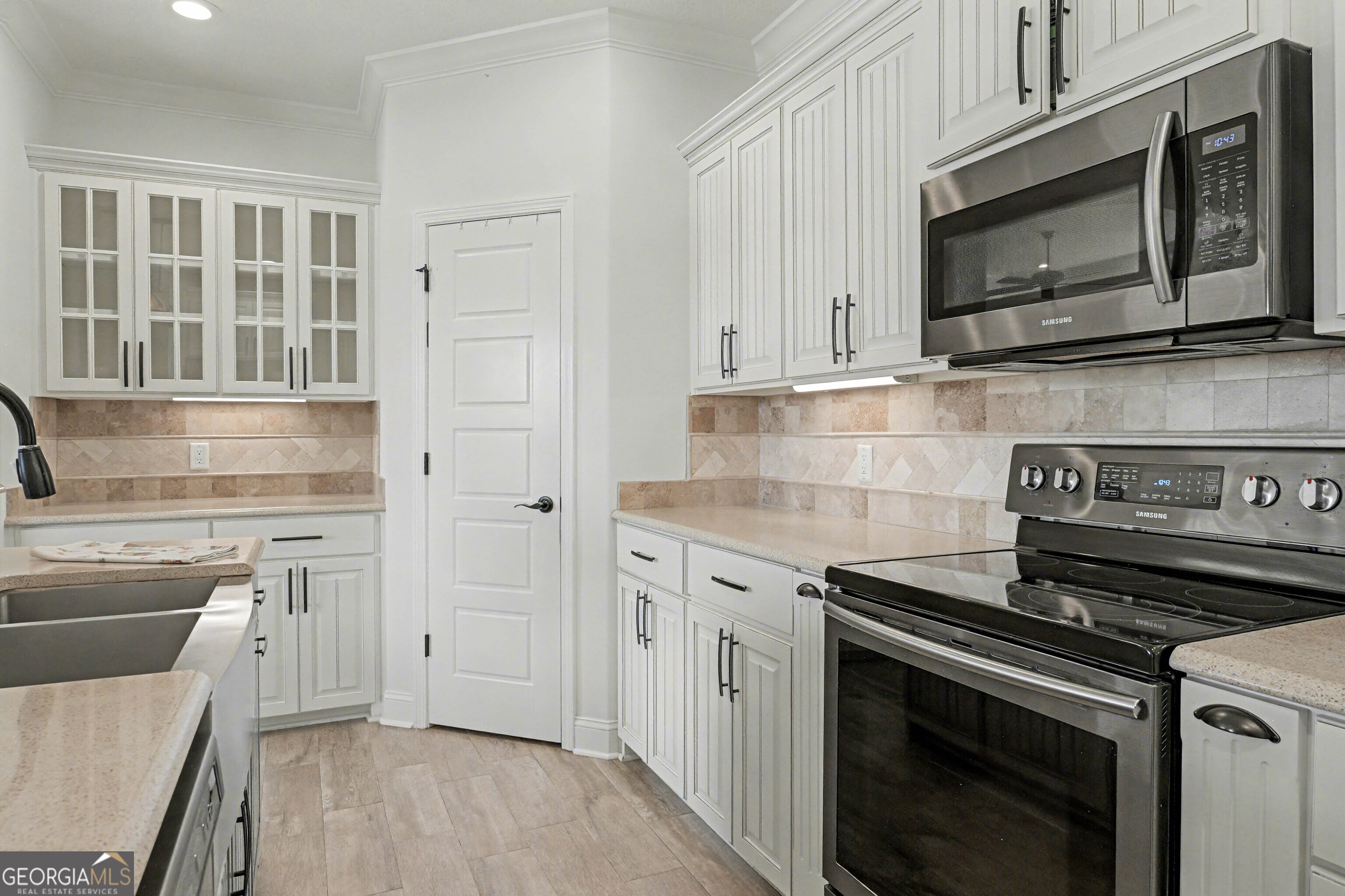 102 Thomas Court Kingsland, GA 31548 - Photo 10 of 59 a kitchen with stainless steel appliances a stove microwave and cabinets