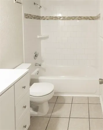 a bathroom with a toilet a sink and a shower