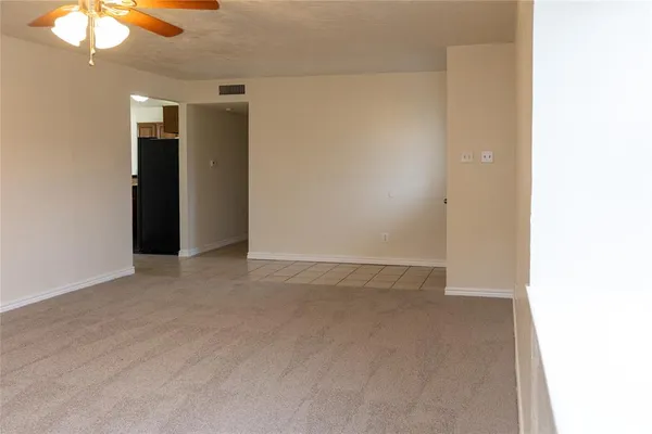 an empty room with a bathroom