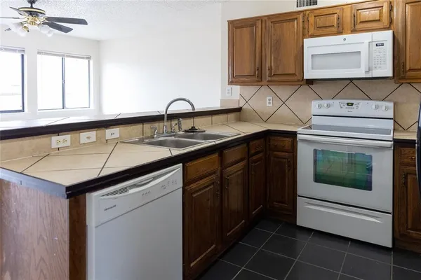 a kitchen with a sink and cabinets