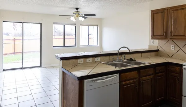 a kitchen with a sink and a window