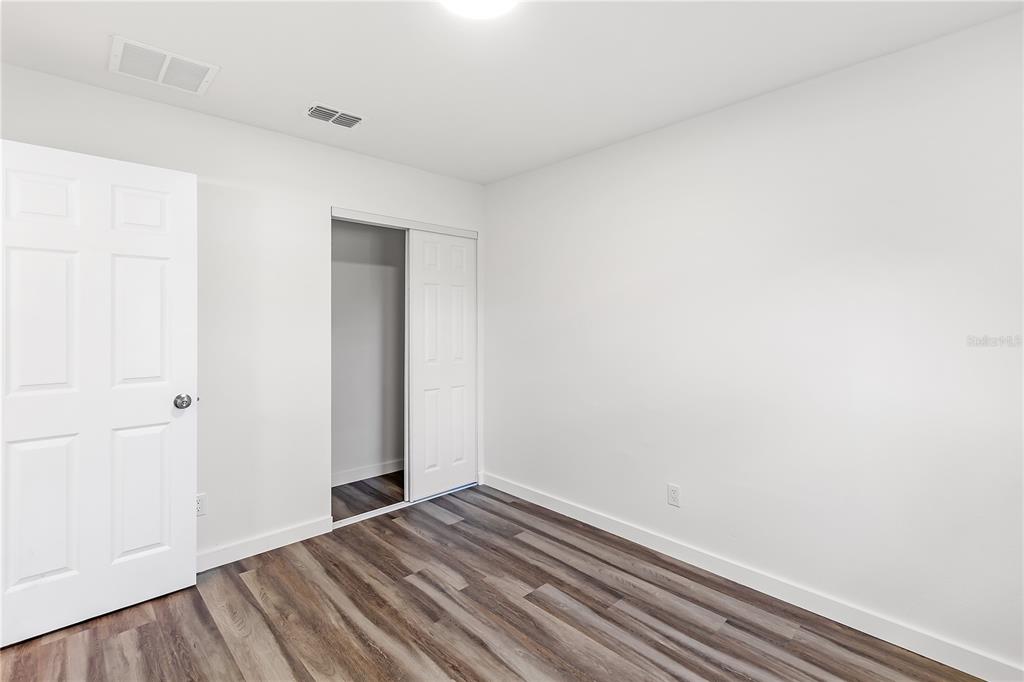 426 Bascom Court Polk City, FL 33868 - Photo 20 of 33 a view of room with wooden floor