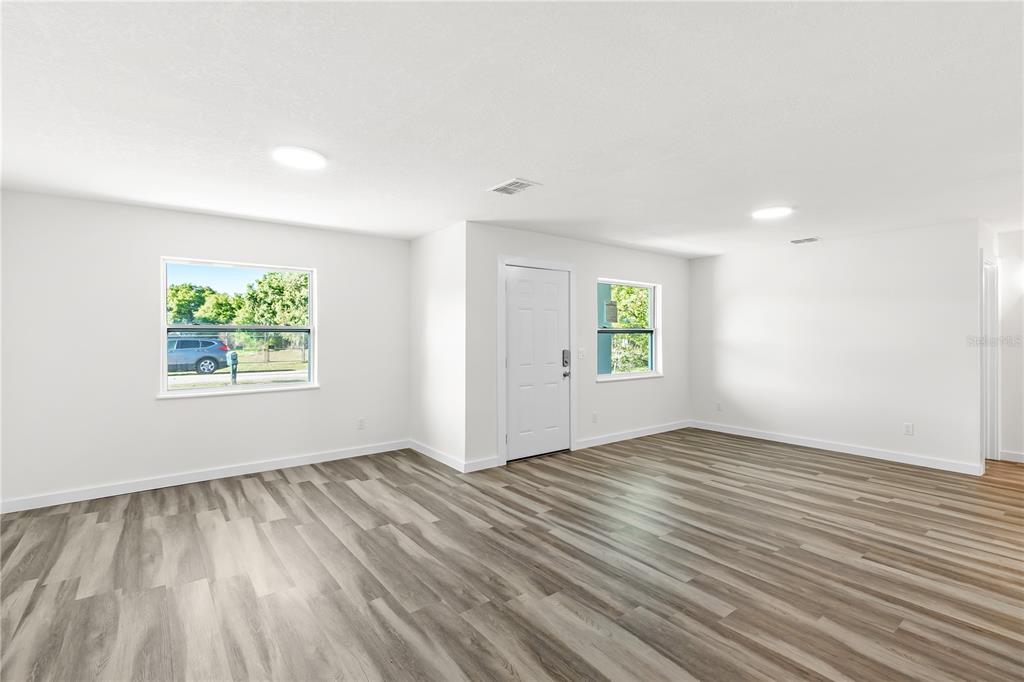 426 Bascom Court Polk City, FL 33868 - Photo 3 of 33 an empty room with windows