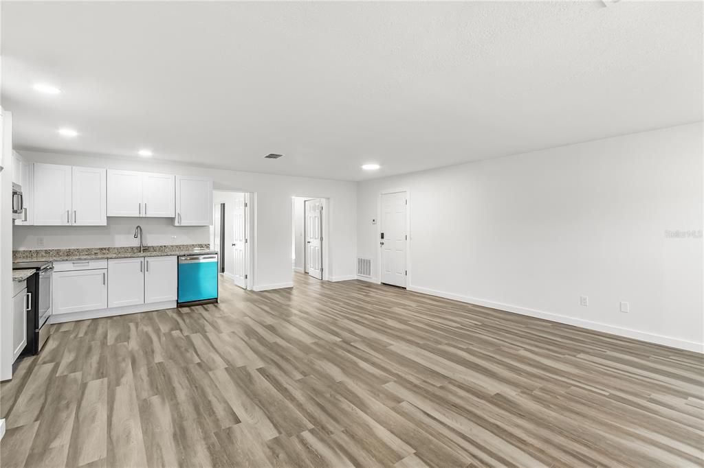 426 Bascom Court Polk City, FL 33868 - Photo 5 of 33 a view of kitchen with wooden floor