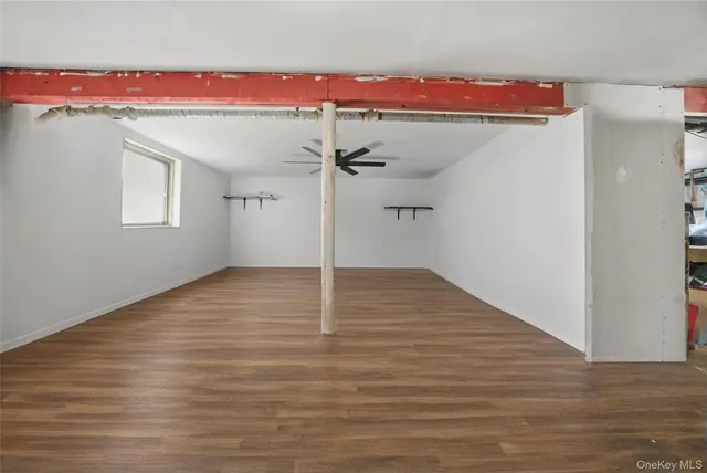 a view of a room with wooden floor