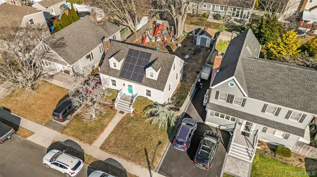 an aerial view of residential houses with outdoor space