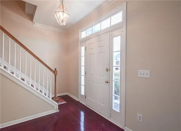 a view of an empty room with a ceiling fan