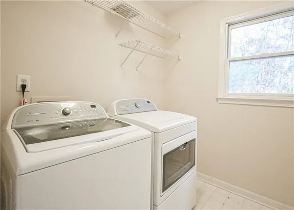 a bathroom with a sink double vanity and tub