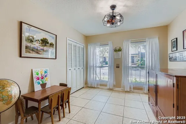 a bedroom with a bed and a desk