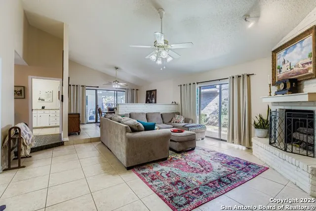 a living room with furniture and a fireplace