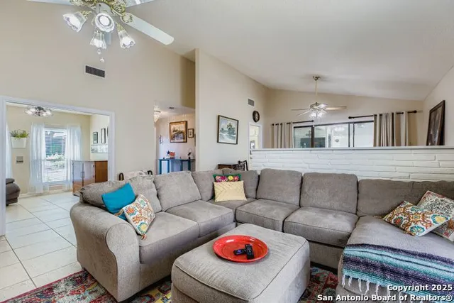 a living room with furniture and a large window