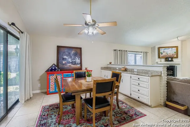a view of a dining room with furniture and a rug