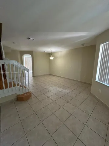 a view of entryway with stairs and a window