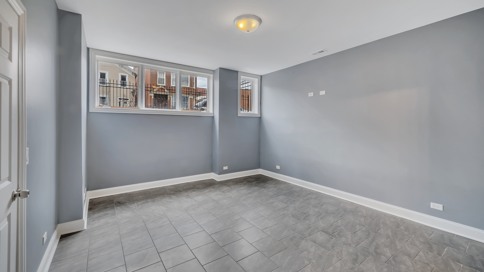 2417 West Fillmore Street, Unit 1 Chicago, IL 60612 - Photo 11 of 19 a view of an empty room with a window