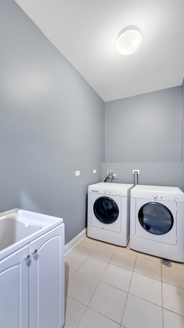 2417 West Fillmore Street, Unit 1 Chicago, IL 60612 - Photo 15 of 19 a view of kitchen with a stove top oven and cabinets