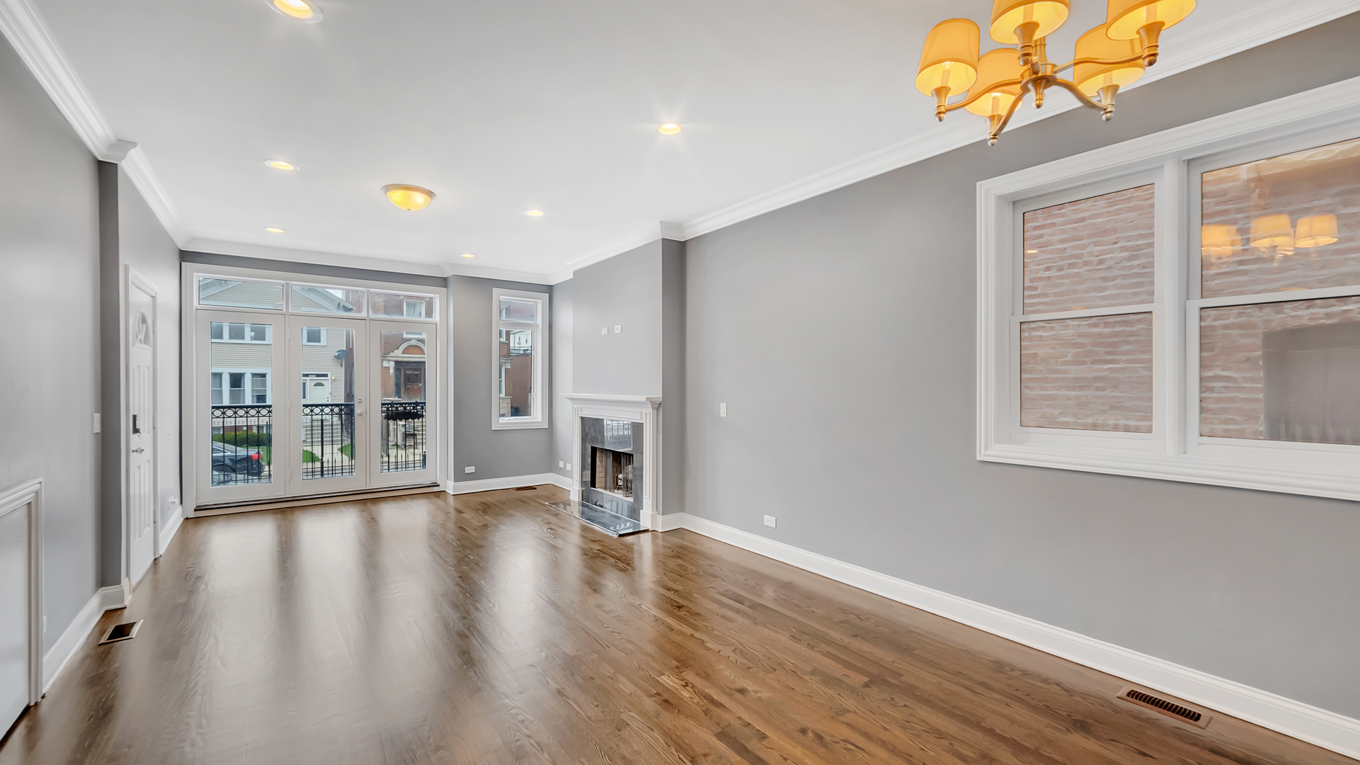 2417 West Fillmore Street, Unit 1 Chicago, IL 60612 - Photo 5 of 19 a view of a big room with wooden floor and windows