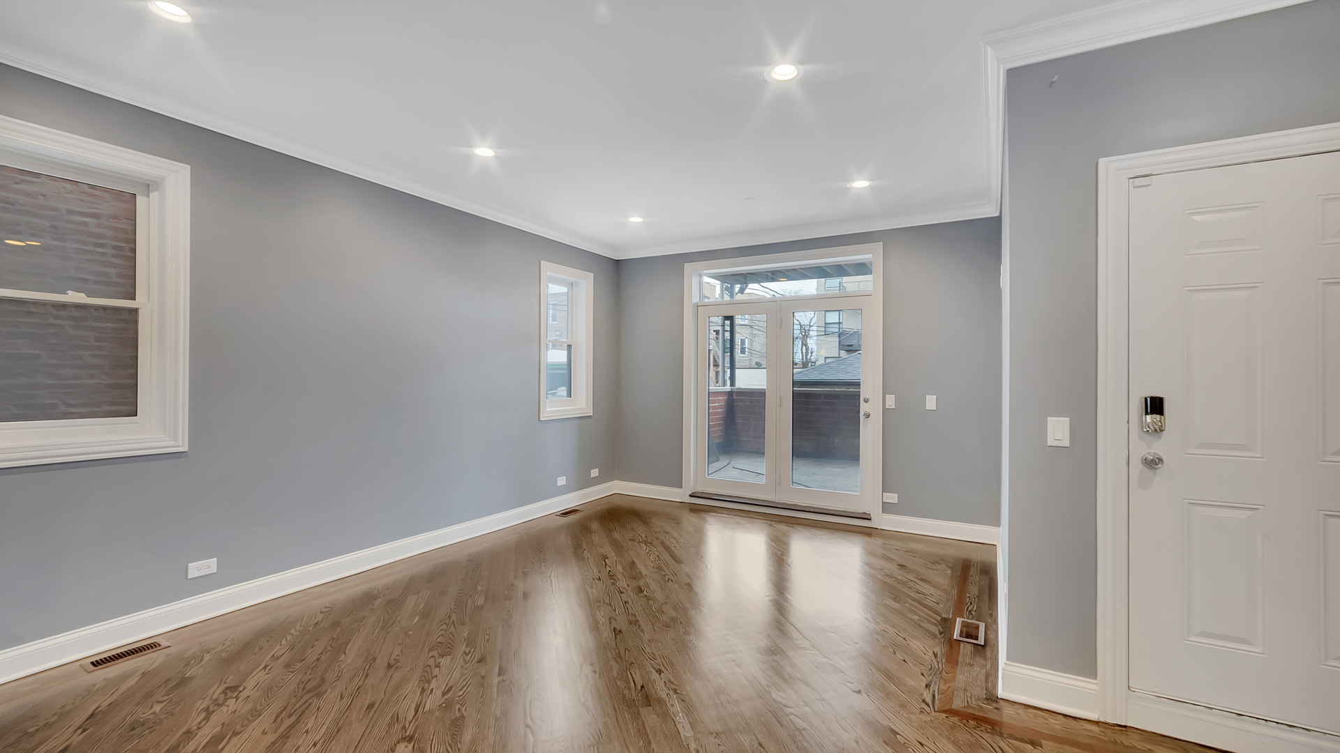 2417 West Fillmore Street, Unit 1 Chicago, IL 60612 - Photo 8 of 19 a view of wooden floor and chandelier in a room