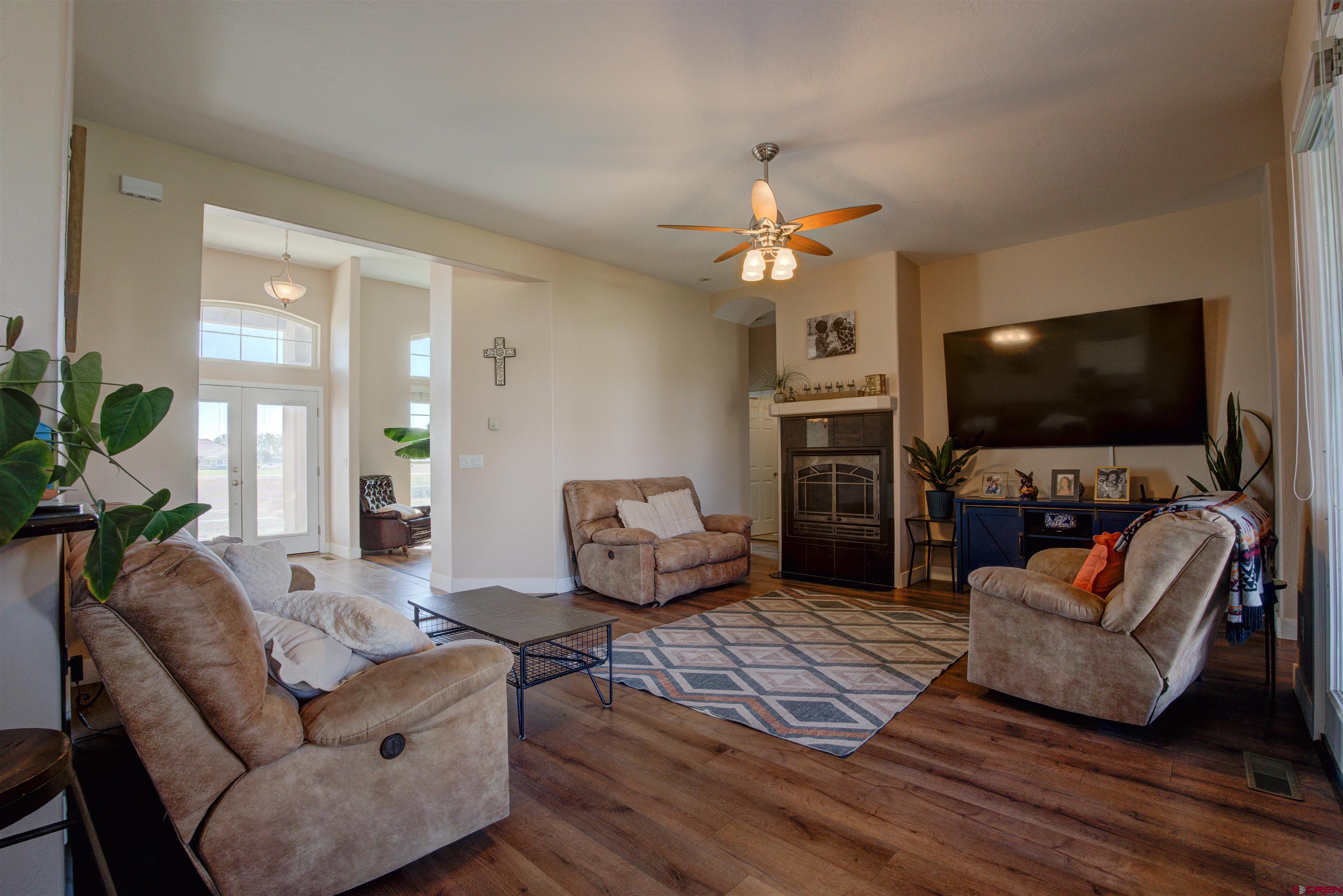 12868 Road 24.4 Loop Cortez, CO 81321 - Photo 15 of 28 a living room with furniture and a flat screen tv
