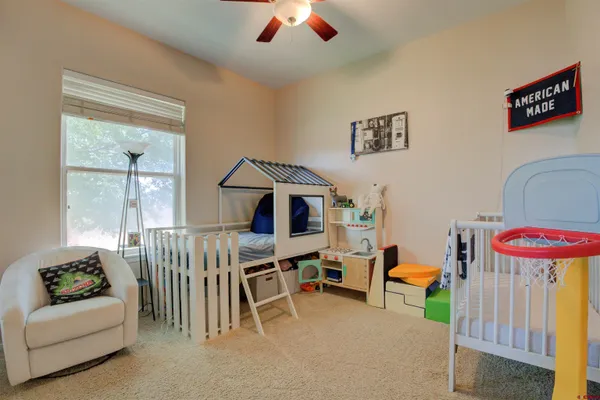 a bedroom with furniture and a chandelier