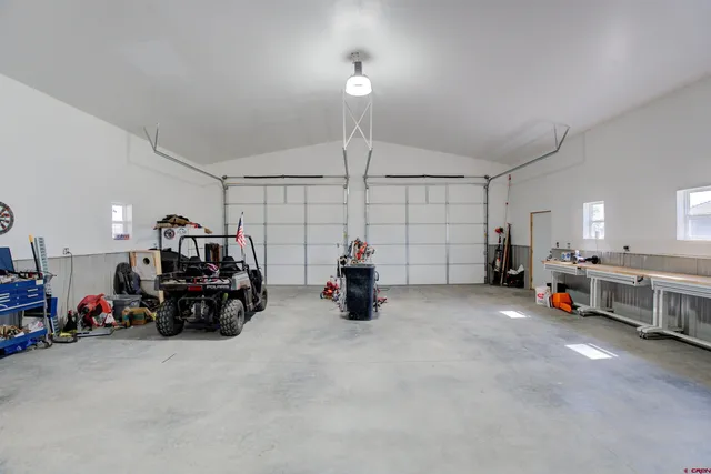 a view of a room with gym equipment and a large window