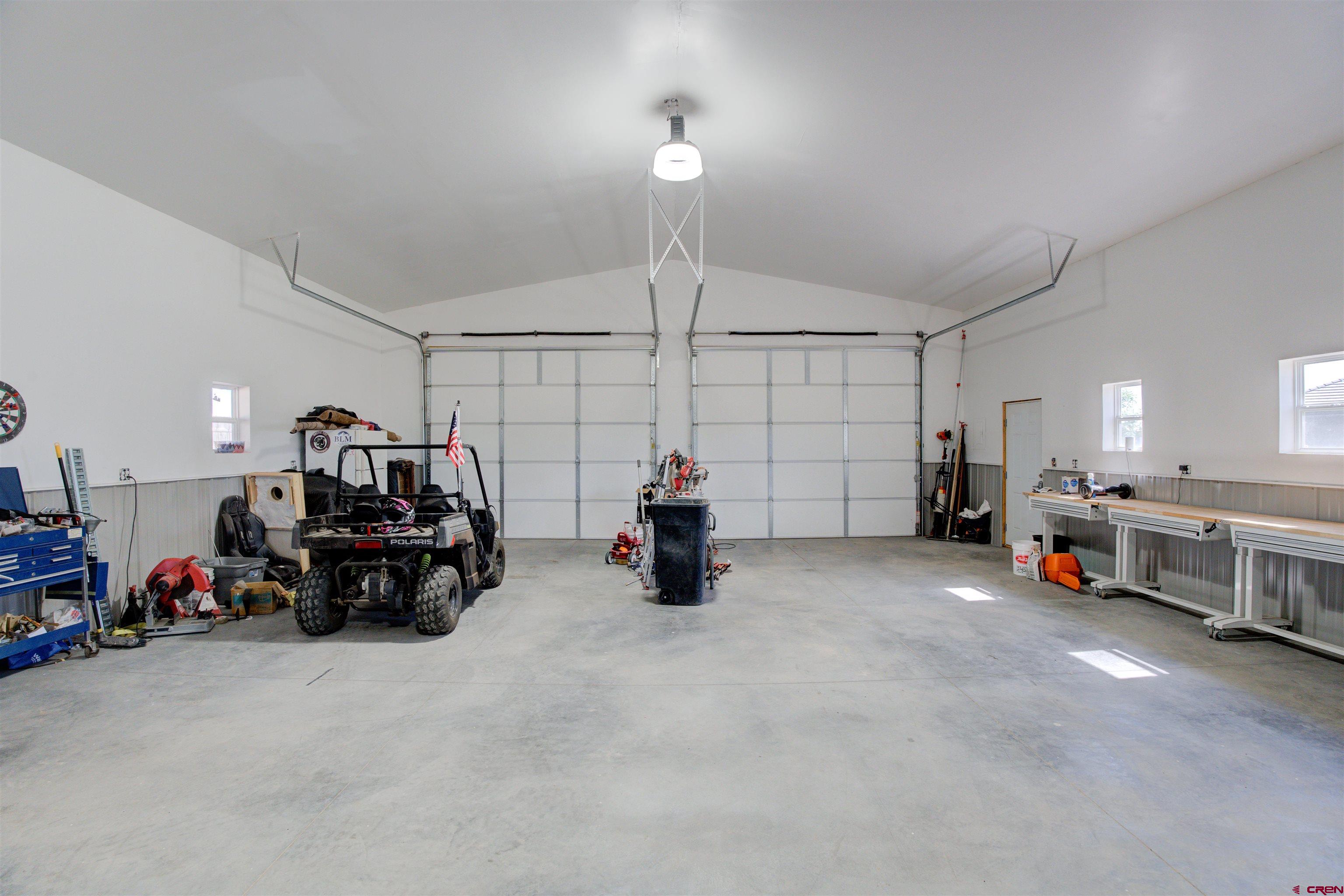 12868 Road 24.4 Loop Cortez, CO 81321 - Photo 24 of 28 a view of a room with gym equipment and a large window