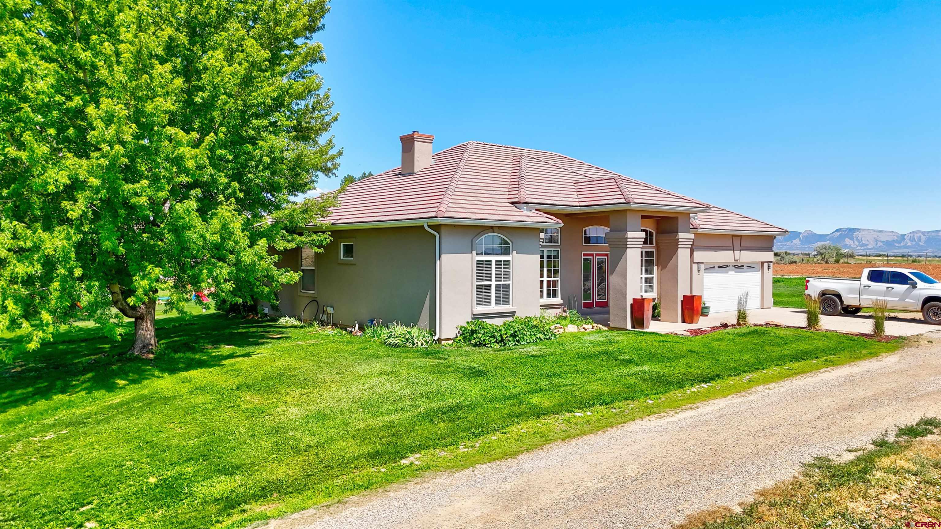 12868 Road 24.4 Loop Cortez, CO 81321 - Photo 25 of 28 front view of a house with a yard