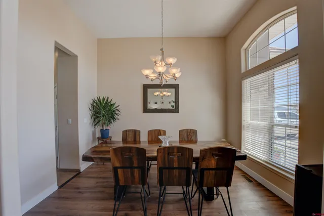 a view of a dining room with furniture and window