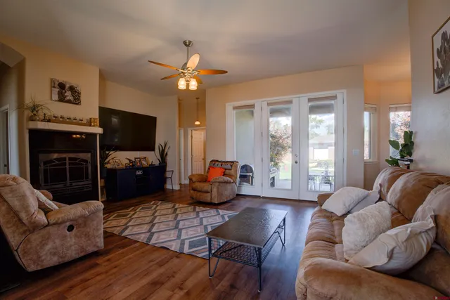 a living room with furniture fireplace and flat screen tv