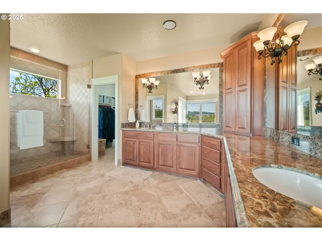 a bathroom with a tub sink and mirror