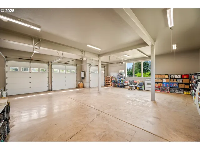 a view of a livingroom with furniture and a garage