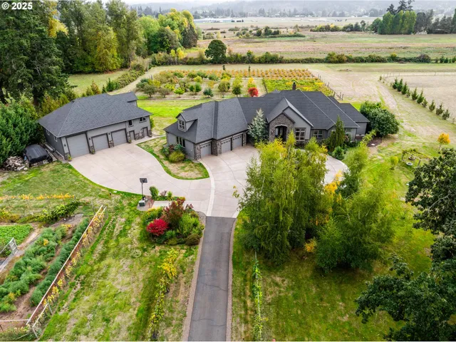 an aerial view of residential houses with outdoor space and swimming pool