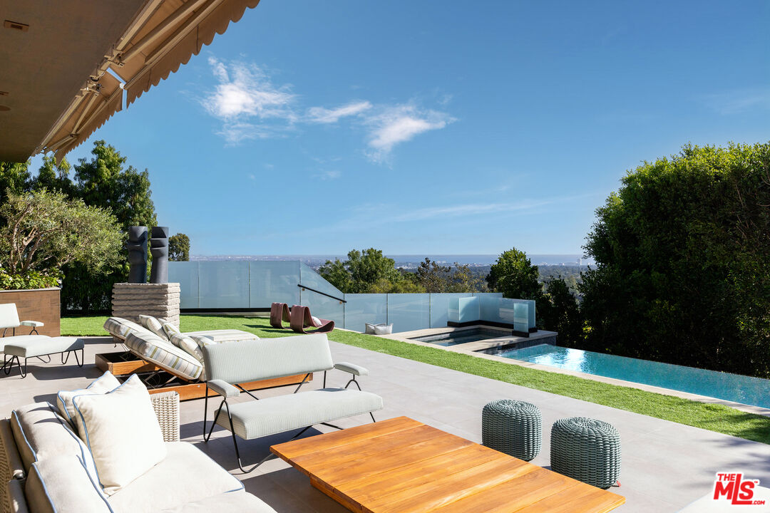 a view of a chairs and table in patio